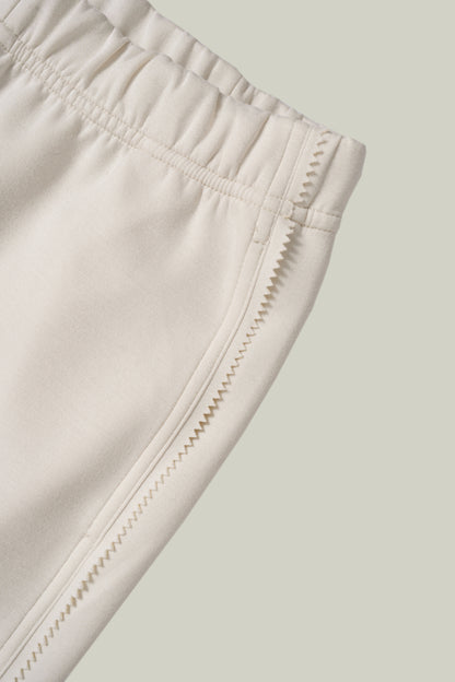 Artisanal lace cuff sweatshirt and straight-leg pants set