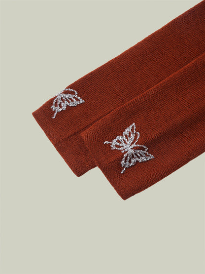 Butterfly embellished high-neck knit