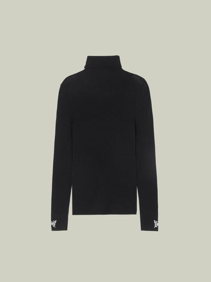 Butterfly embellished high-neck knit