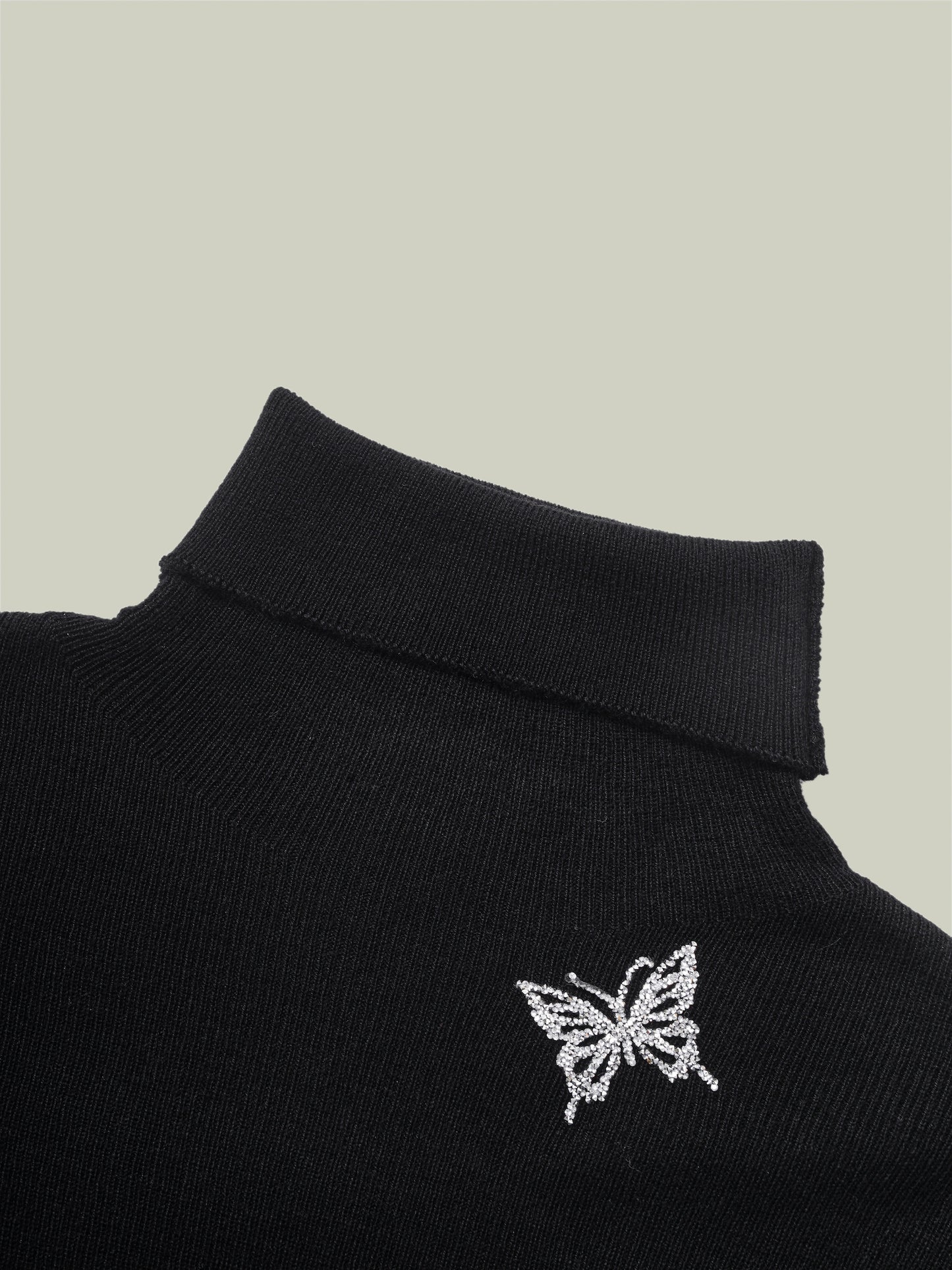 Butterfly embellished high-neck knit