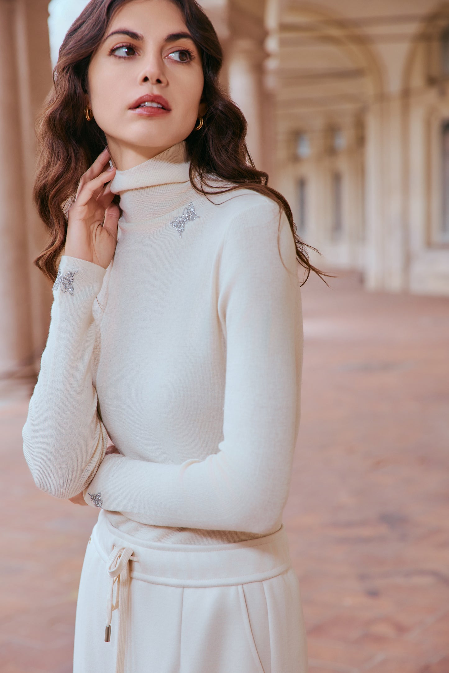 Butterfly embellished high-neck knit