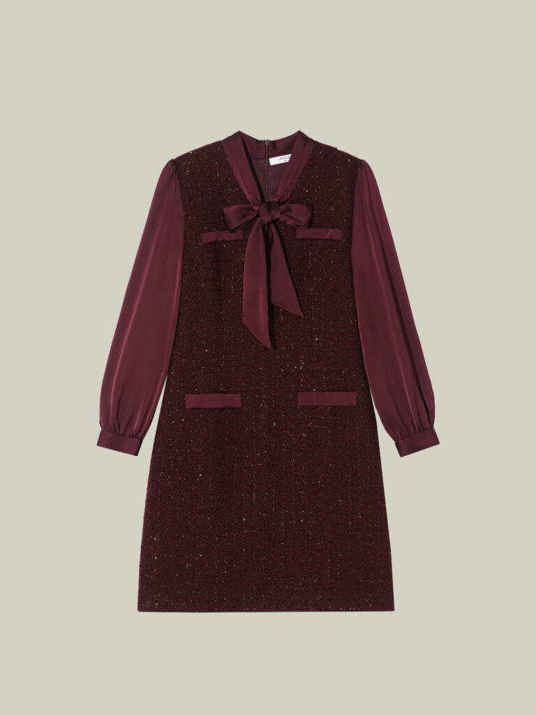 Abito in tweed bouclé dal taglio Chanel