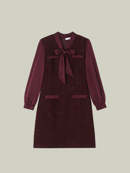 Abito in tweed bouclé dal taglio Chanel