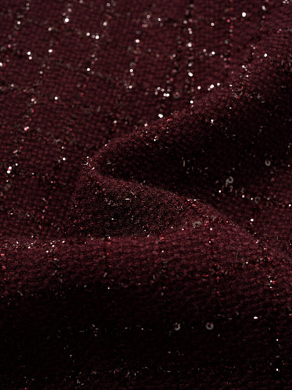 Abito in tweed bouclé dal taglio Chanel