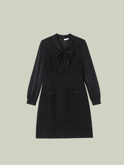 Abito in tweed bouclé dal taglio Chanel