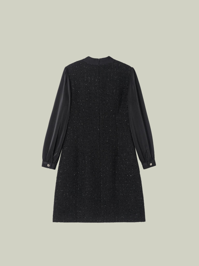 Abito in tweed bouclé dal taglio Chanel