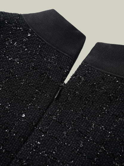 Abito in tweed bouclé dal taglio Chanel